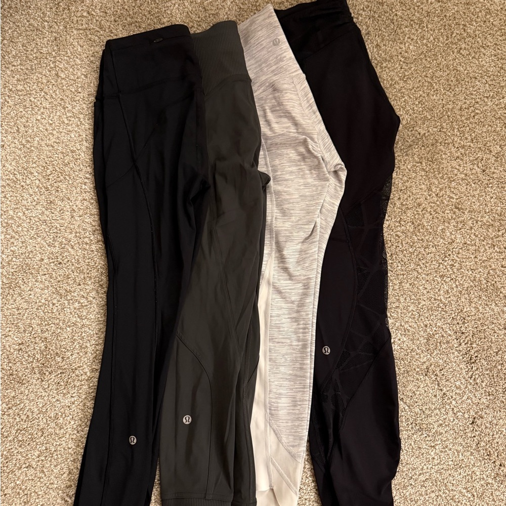 2 pair Lululemon Leggings - one black and one charcoal gray